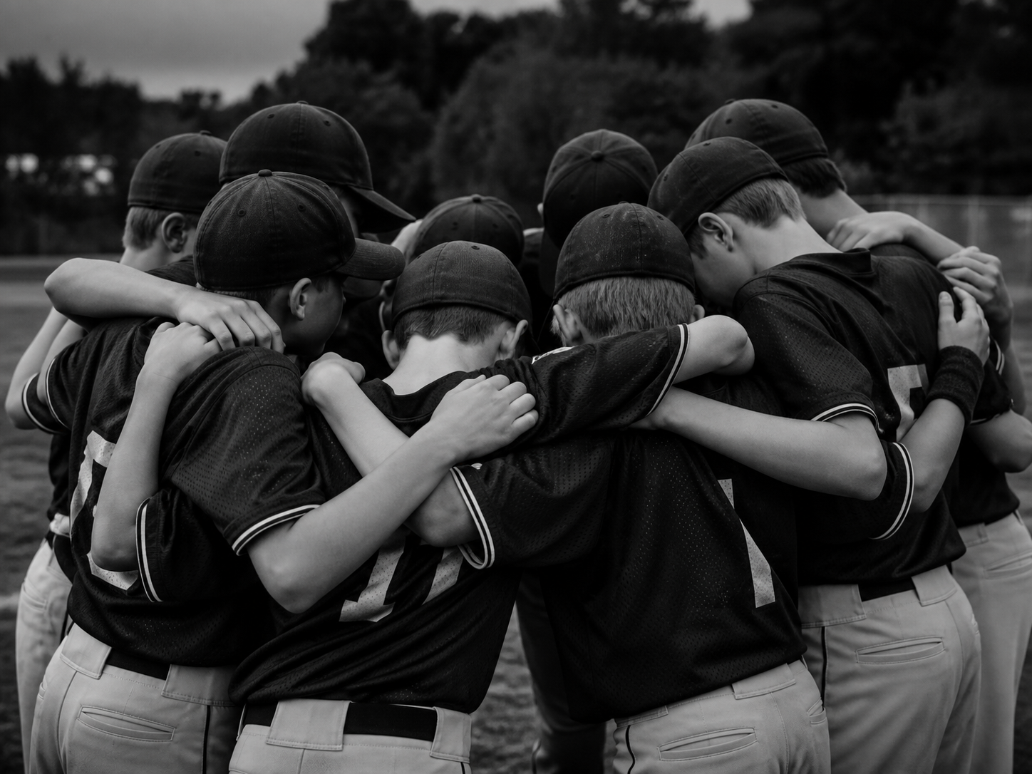 Youth baseball team huddle